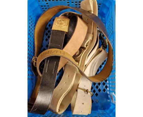 A collection of four military belts to include: British Military white Courlene belt and Kings 'Dieu et Mon Droit' buckle, 24