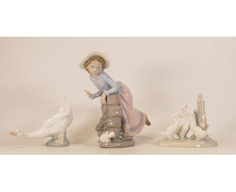 Nao figures to include goose, Girl leaning on wall 2087 and Geese around the tree stump, height of tallest 21cm (3) 