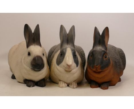 Three North Light figures of rabbits in white/black x2 and brown/ black colourways, height 20cm (3) 