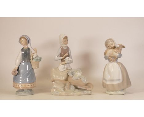 Lladro figures Girl with wheelbarrow 4816, Lladro figure of girl holding basket and jug and Nao figure of girl holding lamb. 