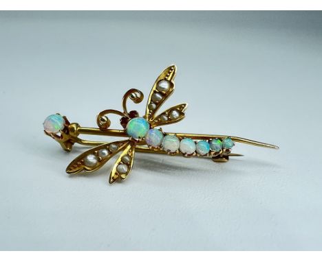 9ct yellow gold,
Victorian dragon fly brooch,
set with opals and sea pearl wings and ruby eyes,
Size 35mm long x 20mm wide,
W