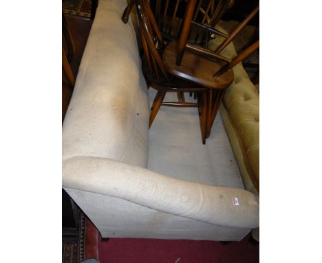 A late Victorian mahogany framed and upholstered three-seater sofa raised on turned forelegs (for re-upholstery)   Condition 