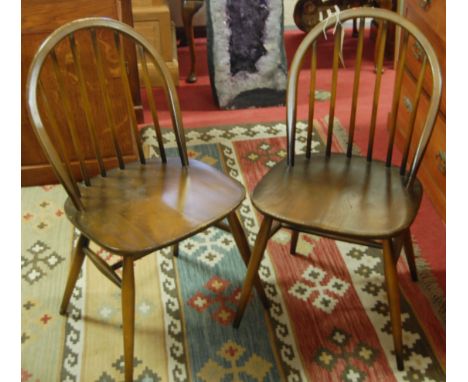 A set of six Ercol dark elm stickback dining chairs (4+2)