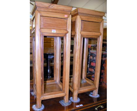 A pair of Chinese stained softwood two tier single drawer lamp tables, width 31cm