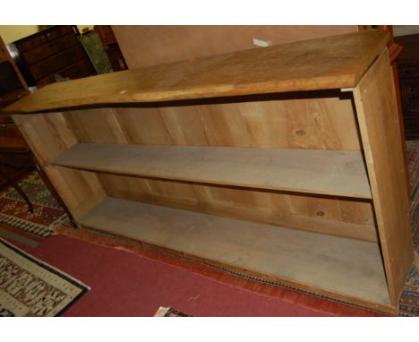An extremely long elm bar, the top of naturalistic outline, with single rear shelf, length 245cm