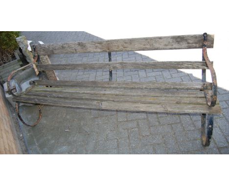 An early 20th century wrought iron ended and pine slatted four seater garden bench, length 182.5cm, together with a square me