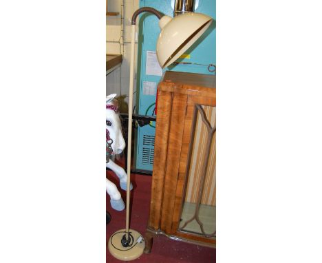 A mid-20th century cream painted metal standard lamp, having adjustable shade (recently PAT tested), h.160cm