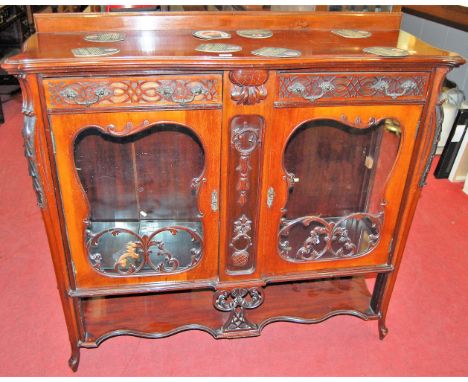 A circa 1900 Chippendale Revival mahogany ledgeback double door glazed china display cabinet, having twin frieze drawers to s