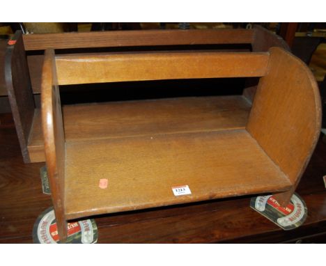 An early 20th century oak table-top book trough, w.47cm, together with a similar wall mounted example (2)