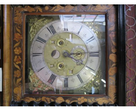 A walnut and marquetry longcase clock, the fret carved cornice over a brass dial with cherub spandrels, silvered chapter ring