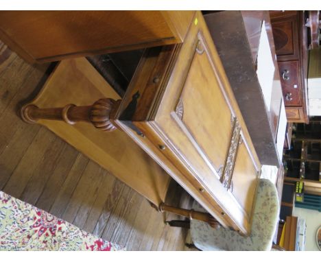 A Fench style light walnut side table, the panelled and carved top over turned tapering legs joined by an undershelf 137cm wi