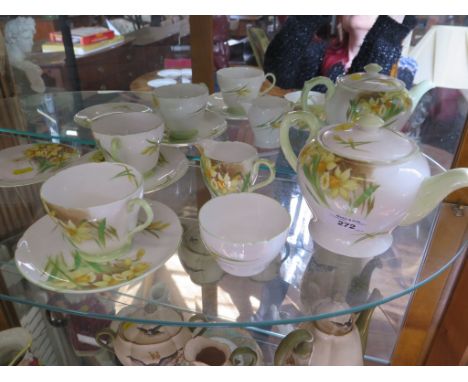 A Shelley part tea service, in a daffodil design including two tea cups and saucers and one tea plate (8)