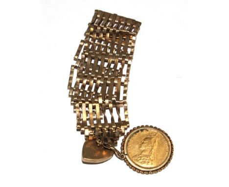 A 9 carat gold gate bracelet with a Victorian sovereign 1892