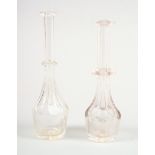 A 19th century cut glass toddy lifter, 6 1/2" high, and another smaller, 6 1/4" high