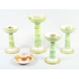 An Aldermaston pottery green glazed candlestick, by Alan Caiger Smith, 10 3/4" high, three similar