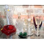 A silver collared decanter, an etched decanter, a cut glass vase, 12" high, a collared glass ashtray
