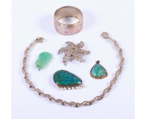 A jade pendant, formed as a gourd, a silver necklace, a malachite brooch, a similar pendant, a filigree brooch and a white me