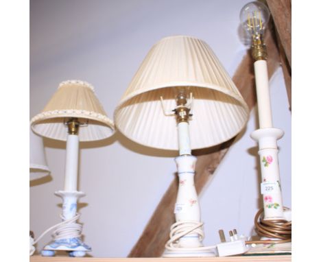 A silver plated table lamp and three china table lamps