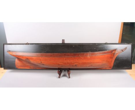 A ship builders "half-hull" scale model, on ebonised plaque, (hull 48" long)Condition: surface scratches, ware commensurate w