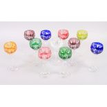 Eleven coloured overlaid and cut glass hocks