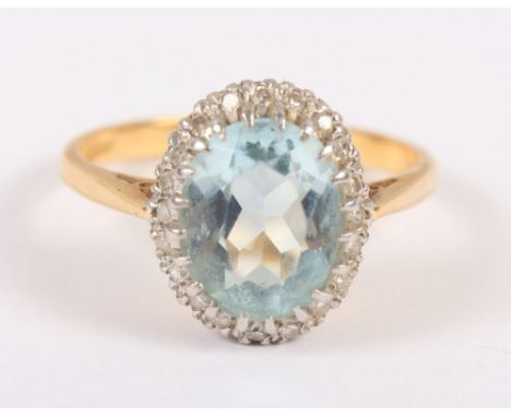 A yellow metal dress ring set central aquamarine with collar of diamonds, stamped 18ct PLAT, size M, 3.7gCondition: Facets wo