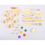 Six ivory napkin rings, ivory handled cutlery, dice, playing counters, a puzzle ball and other items