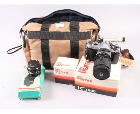 An Asahi Pentax K1000 manual SLR Camera and accessories, in carry case