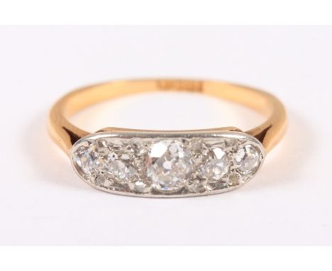 A yellow metal, five stone diamond ring, size K, stamped 18ct Condition: Lacking one chip diamond, light suface scratches and