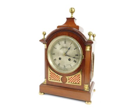 An Edwardian mahogany cased mantel clock, the silvered Roman numeric dial bearing name W. Greenwood Leeds &amp; Huddersfield,