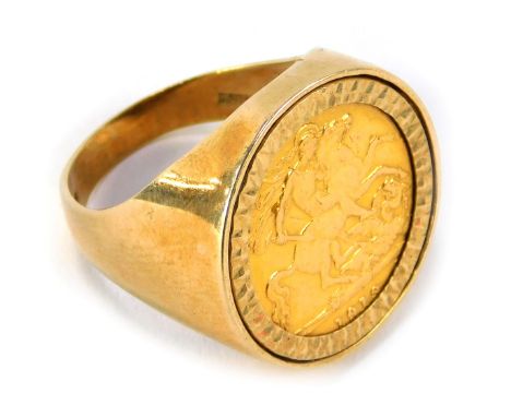 A George V half gold sovereign, dated 1918, in a 9ct gold ring mount, London 1986, size R, 8.8g. 