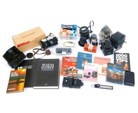 A group of cameras and related equipment, to include a Zenit-B camera, in case, a Prinzflex 28mm lens, further lens, a film s
