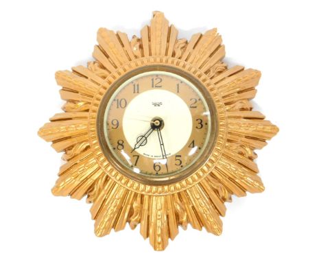A Smiths Sectric sunburst wall clock, with circular Arabic numeral dial, quartz movement, 20cm diameter.