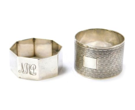 Two silver napkin rings, one of octagonal form, the other of engine turned decoration, 1.65oz. (2) 
