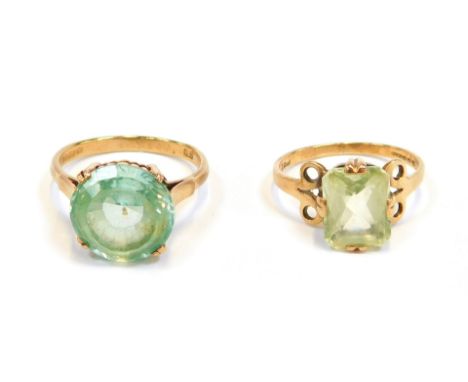 Two 9ct gold dress rings, comprising one set with circular faceted stone in a raised basket, with claw setting, size N½, and 
