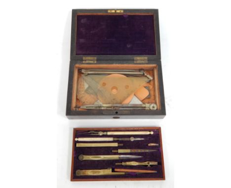 A late 19thC drawing instrument cased set, the top layer with multiple tools and a fitted and lined purple velvet interior, t