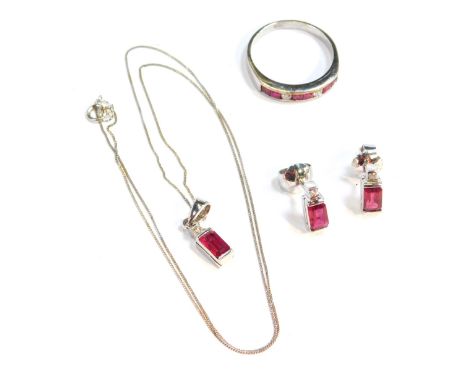 An 9ct white gold ruby and diamond jewellery set, comprising ring, necklace and earrings, the ring set with six square cut ru