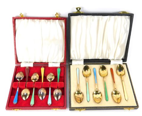 A set of six Elizabeth II silver and enamel teaspoons, cased Birmingham 1958, and a set of six silver gilt and enamel coffee 