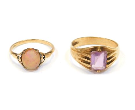 Two 9ct gold dress rings, comprising one set with rectangular cut amethyst, in claw setting, size V, 4.9g all in, and a furth