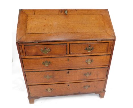 A George II walnut bureau, with cross banding, the fall flap opening to reveal nine recesses and ten drawers with a slide cen
