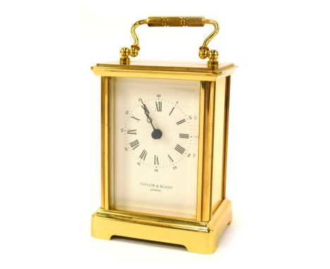 A Taylor and Bligh of London brass carriage clock, with white enamel Roman numeric dial, twin handle, 11cm high, 8cm wide, 7c