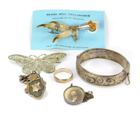 A group of silver and other jewellery, comprising an embossed silver bangle, silver dress ring, watch chain, plated filigree 