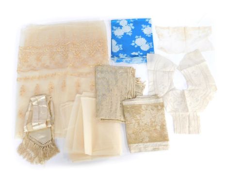 A group of fabric, comprising a Japanese blue Kanebo, section of lace, a cream silk sash with tassels, embroidered metallic s