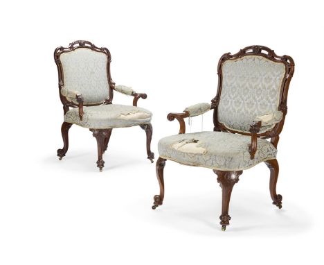 A PAIR OF GEORGE III MAHOGANY ARMCHAIRS  ATTRIBUTED TO WILLIAM AND RICHARD GOMM, CIRCA 1760  Each with a shaped padded back, 