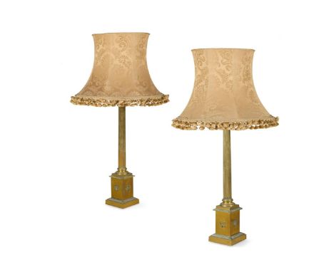 A LARGE PAIR OF BRASS CLASSICAL COLUMN LAMP BASES  EARLY 20TH CENTURY  With brown and white floral fabric shades, bases with 