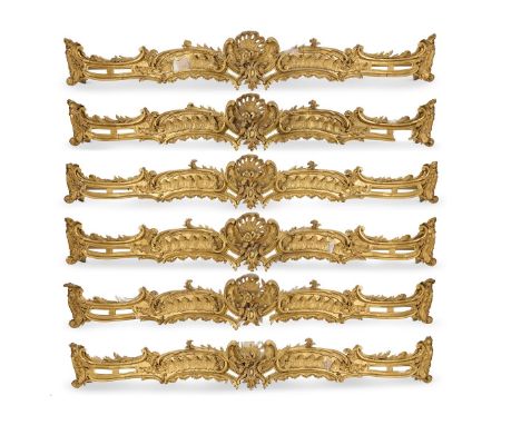 A SET OF SIX WILLIAM IV GILTWOOD AND COMPOSITION CURTAIN PELMETS  CIRCA 1835 In George III style, with central shell and scro