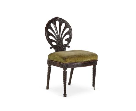 A MAHOGANY ADJUSTABLE SIDE CHAIR CIRCA 1900, OF GEORGE III STYLE, POSSIBLY BY SIDNEY LETTS The foliate-carved back with pierc