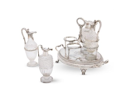 A GEORGE III SILVER OVAL TWIN HANDLED CRUET STAND  PAUL STORR, LONDON 1806  With a reed, stitch and foliate central loop hand