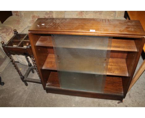 A OAK BARLEY TWIST STICK STAND TOGETHER WITH A GLASS FRONTED BOOKCASE