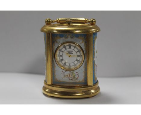 A HALCYON DAYS ENAMELS MINIATURE CARRIAGE CLOCK WITH CHERUBIC DETAIL