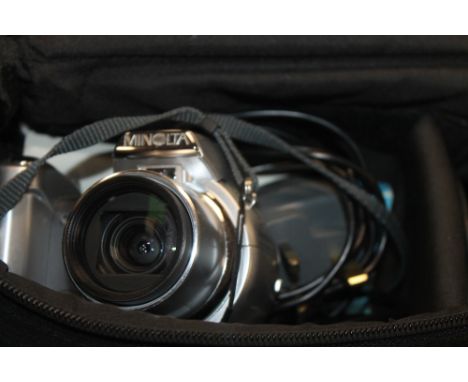 A CASED MINOLTA CAMERA AND ACCESSORIES